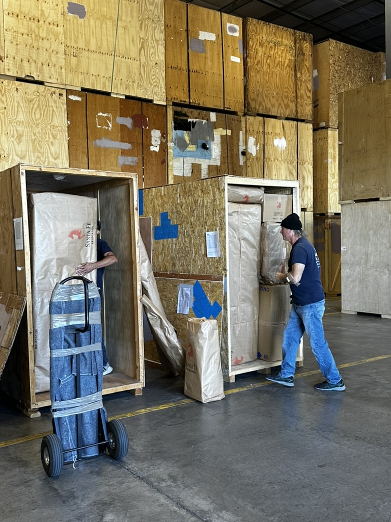 Crew in warehouse crating an international shipment