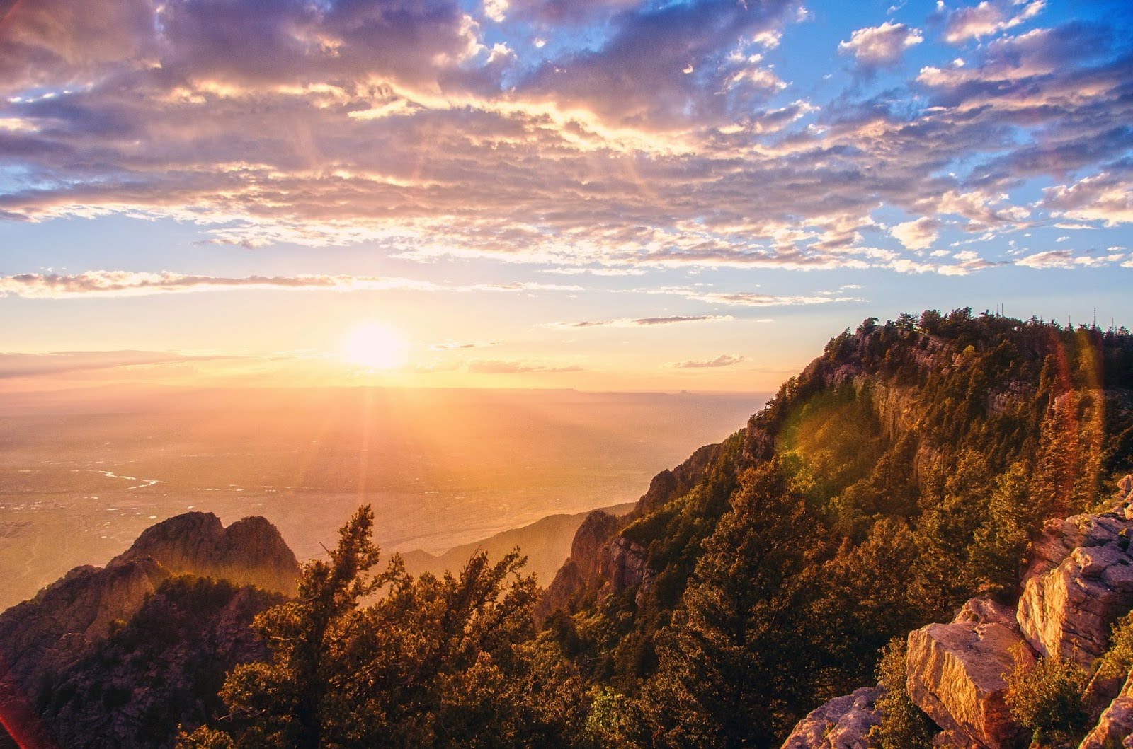 sunrise in the Sandia Mountains, New Mexico with a lens flare